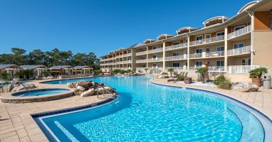 Our 4 pool 2 hot tub pool deck follows the shape of our 64 unit complex