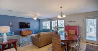 Main level family/dining room.  Back patio faces the inground pool