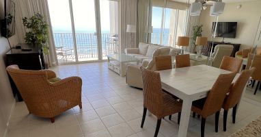 Endless water views from living, dining, kitchen.  Slipcovered sofa. Roku 55 TV.