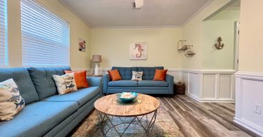 The living room offers 2 full size couches. One of them is a queen sleeper sofa.