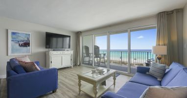 Perfect for relaxing after a beach day, the living room offers comfortable seating and front row views of the Emerald Coast.