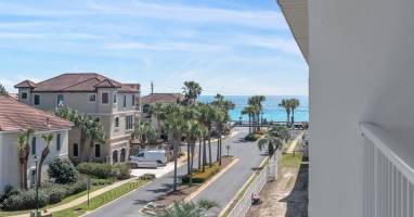 Sit back, relax, and take in the palm-lined street and sparkling Gulf beyond - just steps from Maravilla-s private beach access.