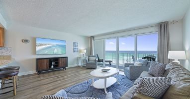 Perfect for relaxing after a beach day, the living room offers comfortable seating and front row views of the Emerald Coast.