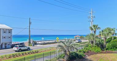 Balcony views that stretch to the emerald waters of the Gulf - just steps away.