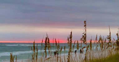 Beautiful Sunset at the Beach - This condo comes with Free Daily Beach Chairs/Umbrella Set Up”