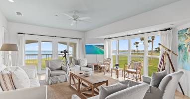 Open-concept living area designed to highlight panoramic golf course and bay views. This second-floor corner condo offers added privacy and is perfectly suited for golf-focused getaways.