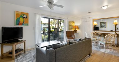 Relax in your bright, open living space with a cozy sofa facing the TV, while the dining area and balcony beckon for memorable moments together.