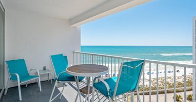 Sip your morning coffee on your private balcony while turquoise waves dance before pristine white sand.