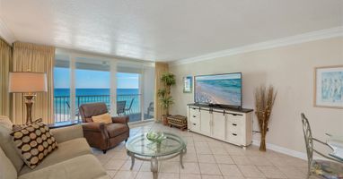 Relax in your oceanfront living room with stunning sea views and beach scenes on the wall-mounted TV.