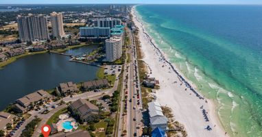 Wake up to breathtaking Emerald Coast views, sugar-white sand, and turquoise waters just steps away. The red marker highlights the convenient location of the unit near beaches, dining, and local attractions.