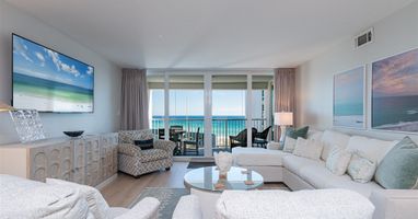 Relax in your oceanfront living room with stunning sea views through floor-to-ceiling windows and your private balcony awaiting.
