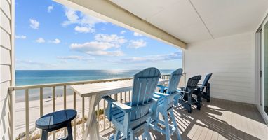 Relax on your private balcony with stunning ocean views. Comfortable seating awaits while you sip morning coffee or watch the sunset over pristine beaches.