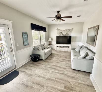 Upstairs game room with large flatscreen TV for video games