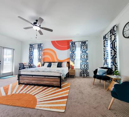 Huge Master's Bedroom with a King Bed, Smart TV, Workspace, and a Small Area for Coffee