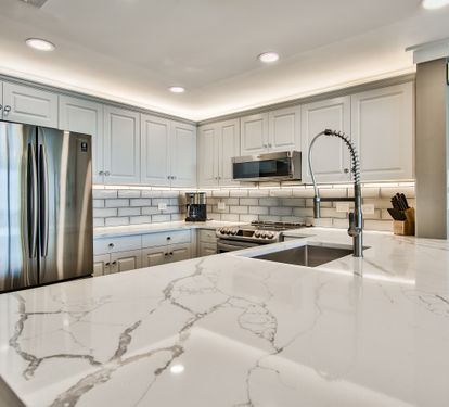 Kitchen with quartz counter tops and stainless steel appliances