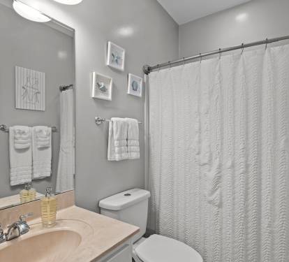 Clean, calm, and beachy — this extra bathroom is situated between the two extra bedrooms, the perfect place to refresh and recharge.