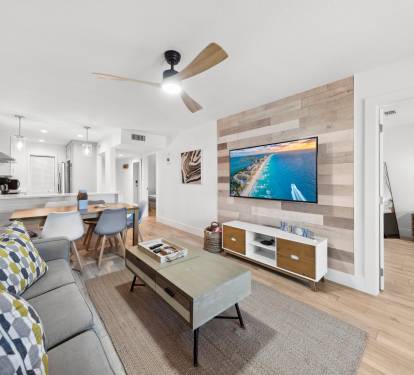 Updated condo and comfortable living room with a large screen TV 