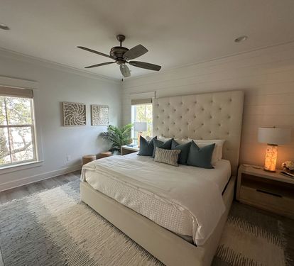 Spacious 2nd level king bedroom suite with full ensuite bathroom, tiled shower, dual vanity sinks, and newly remodeled outdoor shower.