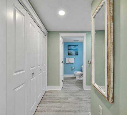 Hallway leading to second bathroom