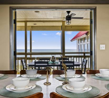 Step out onto the spacious porch deck, just meters away from the ocean, and take in the stunning views while enjoying the coastal breeze.