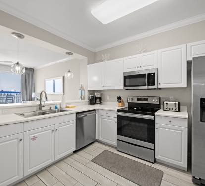 Bright kitchen w/ clean lines and plenty of counter space for easy meals.