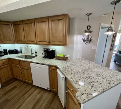 Wrap around countertop with 2 stools for extra seating