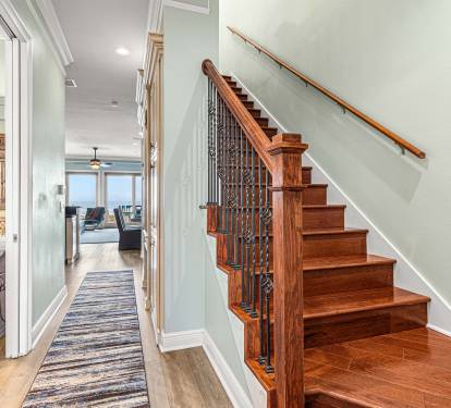Main floor hallway and stairs up to the top level. 