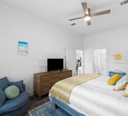 The master bedroom offers a quiet reading corner and a TV for nighttime movies.