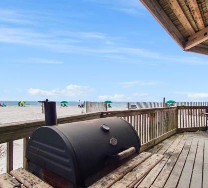 Outdoor barbecue grills perfect for casual meals by the pool.