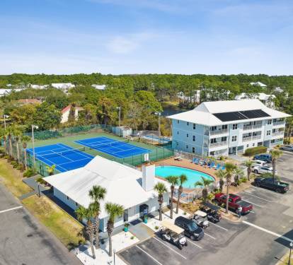 The condo, tennis courts, and swimming pool