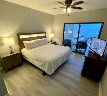 East Master bedroom king bed, balcony. built in USB in night stands