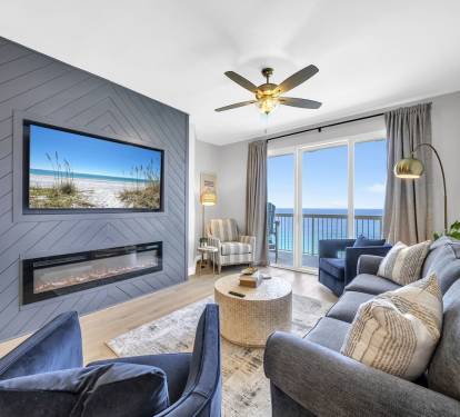 Nights are cozy around this electric fireplace & 65" smart TV paired with that breathtaking view!