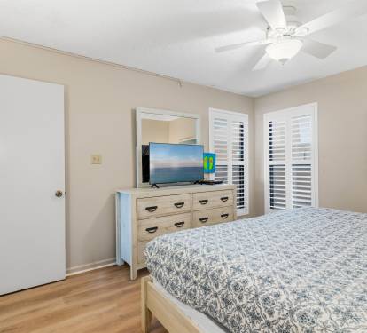 Coastal furnishings and natural light create a bright and relaxing retreat.