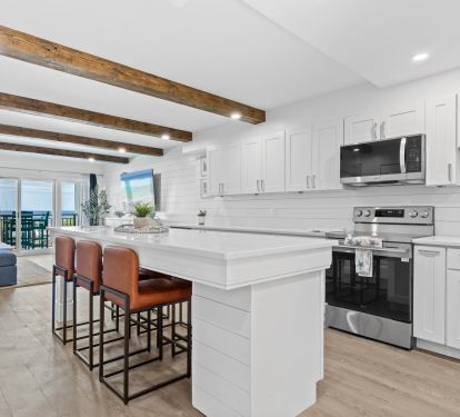 Stainless steel appliances and large sink for family meals together