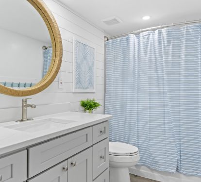 Open the pocket door to reveal the en suite bathroom