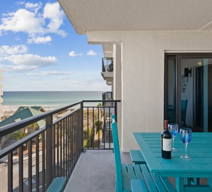 There is a large picnic table for al fresco dining with views of the beach.