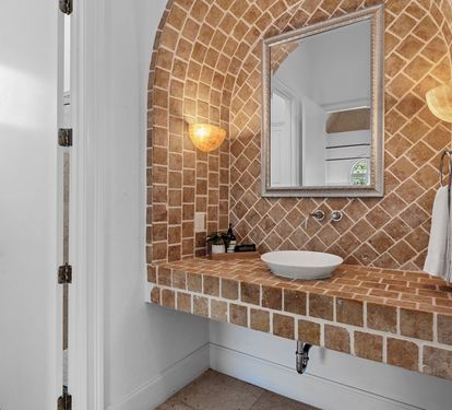 Architectural bath with custom tile and arched design