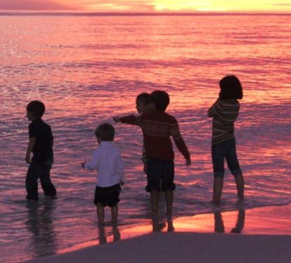 Family fun at sunset!  Our condo is THE choice for your family beach vacations!