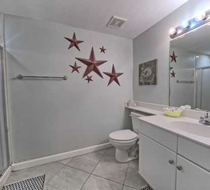 Bunk room's full bathroom. Walk in shower, vanity with plenty counter space. 