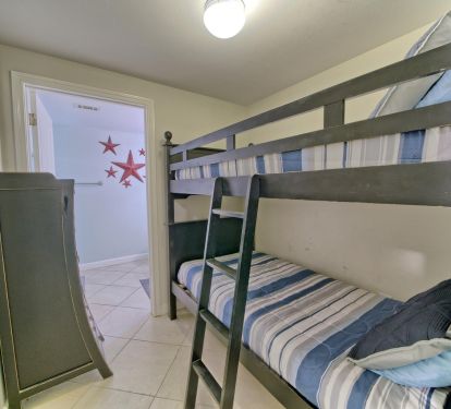 Bunk room with a privacy entry door so kids sleep well! 