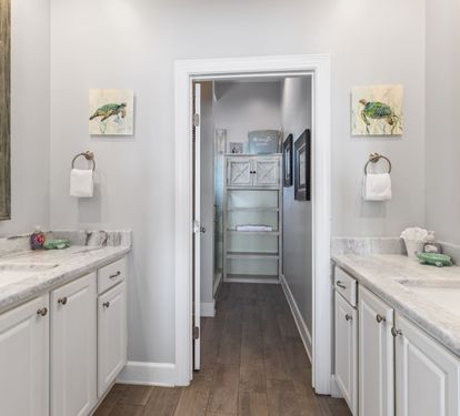 Primary ensuite with double vanity and walk-in shower