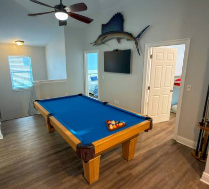 From late-night pool games to afternoon breaks from the sun, the upstairs entertainment space is made for spending time together.