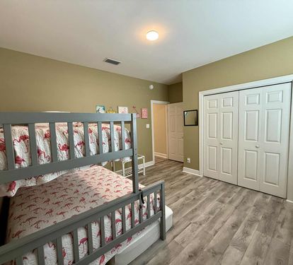 Upstairs bunk bed trundle (two twin and one full mattress).