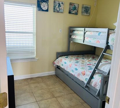 First level bunk bed trundle (two twin and one full mattress).