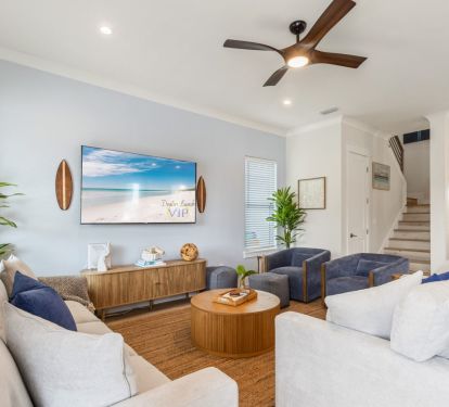 Spacious living area with coastal decor