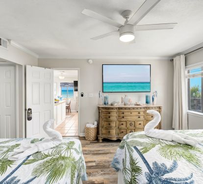 Enjoy beach views from the luxurious bedroom