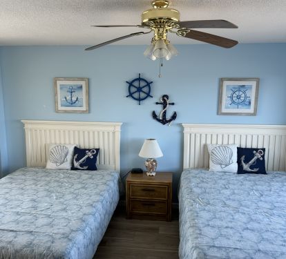 3rd bedroom with queen sized beds and private balcony