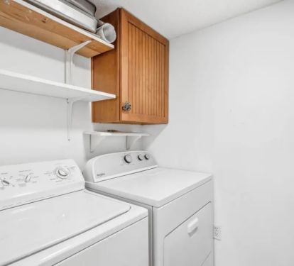 Laundry room with full sized washer and drier