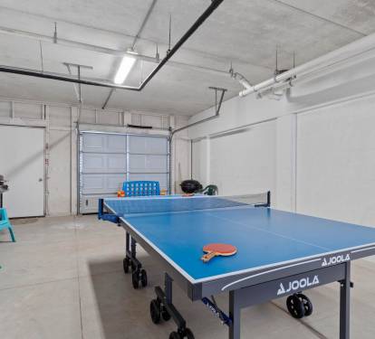Garage With Ping Pong Table, Grill, & Extra Fridge