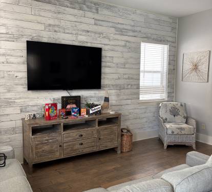 Cozy living room details with stylish furnishings and game storage.